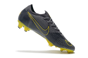 CHUTEIRA NIKE MERCURIAL VAPOR 12 FG ELITE "GAME OVER" CINZA/AMARELO